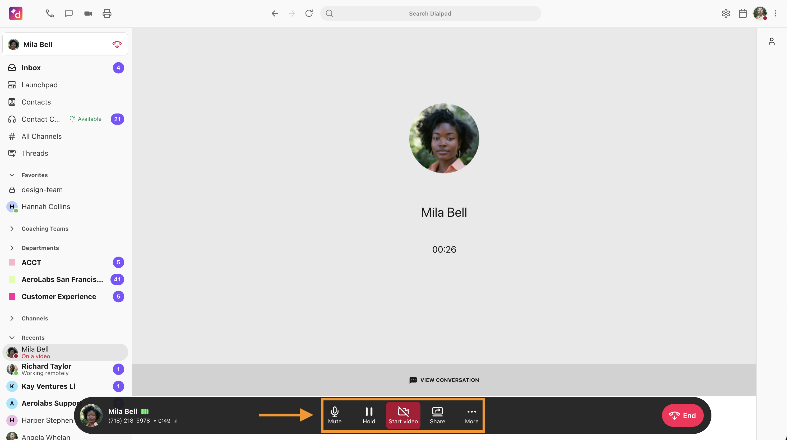 Screenshot of an active video call in Dialpad, with an orange arrow and box highlighting the bottom control bar featuring Mute, Hold, Start video, Share, and More icons.