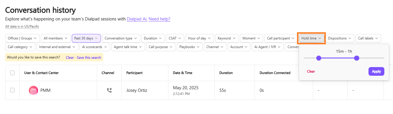 Screenshot of Dialpad's Conversation History page showing the 'Hold time' filter pop-up open with a duration range slider set from 15m to 1h, highlighted by an orange box around the 'Hold time' filter button.