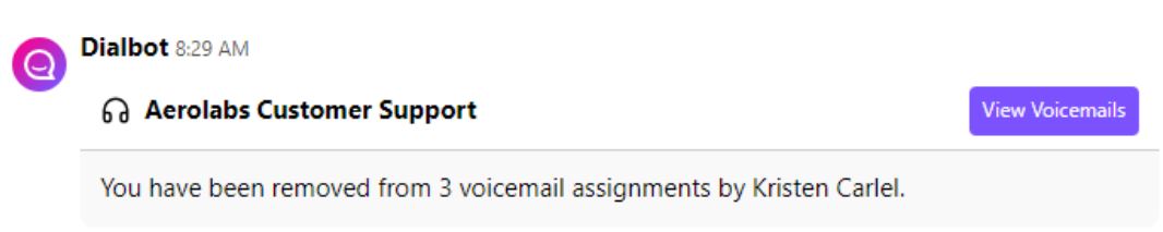 Screenshot of a Dialbot notification message stating that a user has been removed from 3 voicemail assignments by Kristen Carlel, with a purple 'View Voicemails' button for Aerolabs Customer Support.