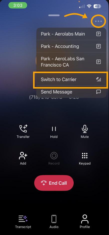 Screenshot of Dialpad mobile app active call screen, with an orange arrow highlighting the three-dot options menu at the top right and an orange box around the 'Switch to Carrier' menu option.