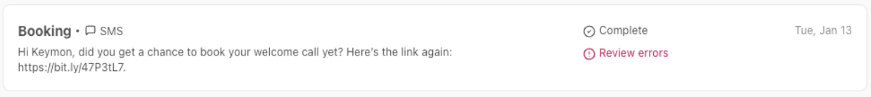 Screenshot of a sent SMS entry containing a shortened bit.ly link, marked with a red 'Review errors' alert status.