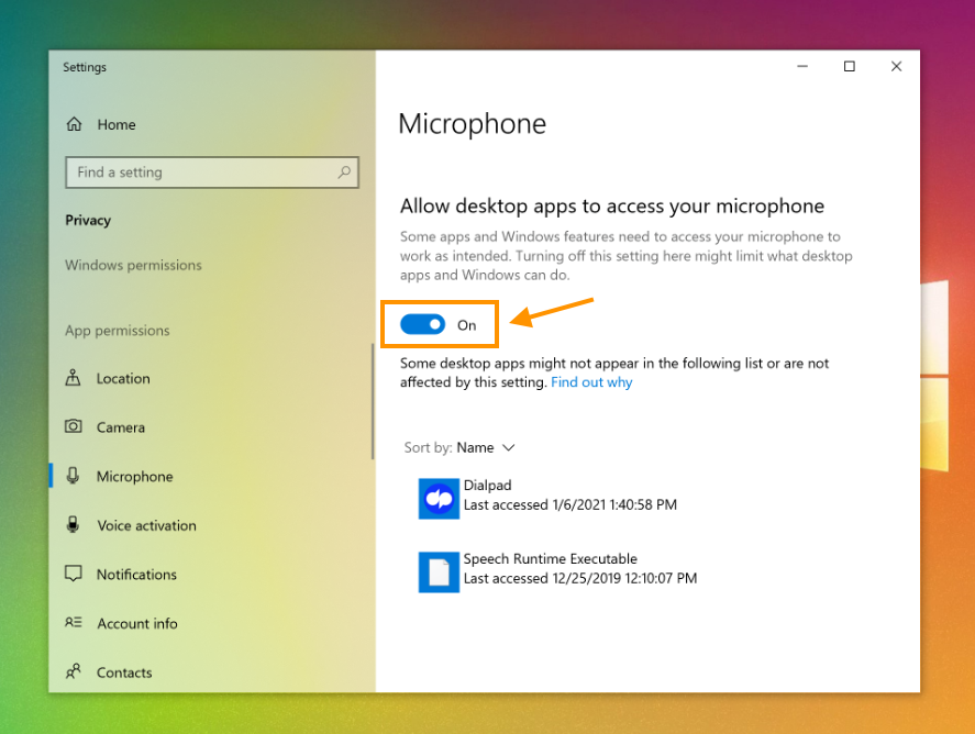 Screenshot of Windows Privacy Settings under Microphone permissions, featuring an orange box and arrow highlighting the toggle switch set to On for 'Allow desktop apps to access your microphone'.