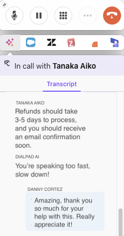 Screenshot of the Dialpad Companion Mode floating call widget displaying call controls at the top, an active call header with 'Tanaka Aiko', and a live call transcript showing real-time dialogue and Dialpad AI feedback.