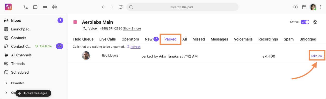 Screenshot of the Dialpad desktop app displaying the Aerolabs Main Shared Line inbox with orange boxes highlighting the selected 'Parked' tab and the 'Take call' button next to a parked caller listing.