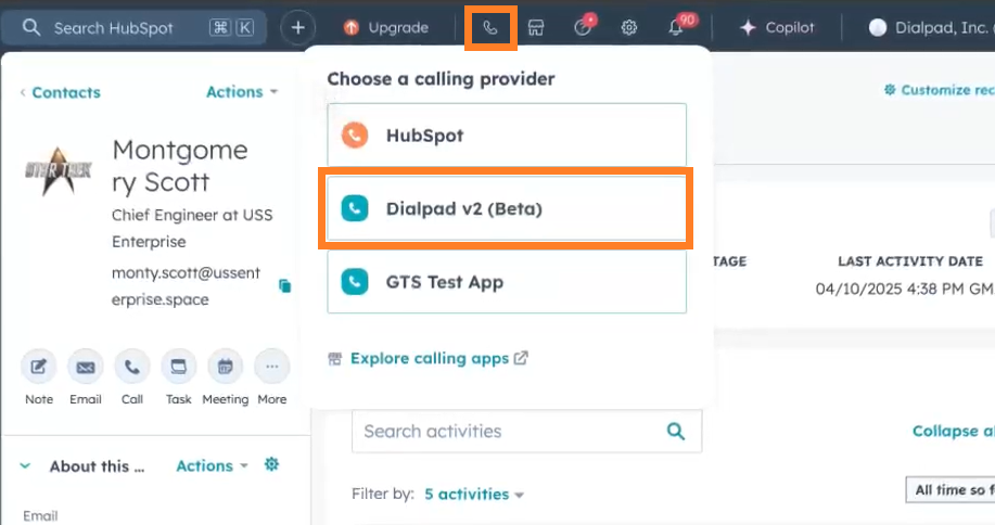 Screenshot of the HubSpot contact view with orange boxes highlighting the phone icon in the top header and the 'Dialpad v2 (Beta)' selection inside the 'Choose a calling provider' dropdown menu.