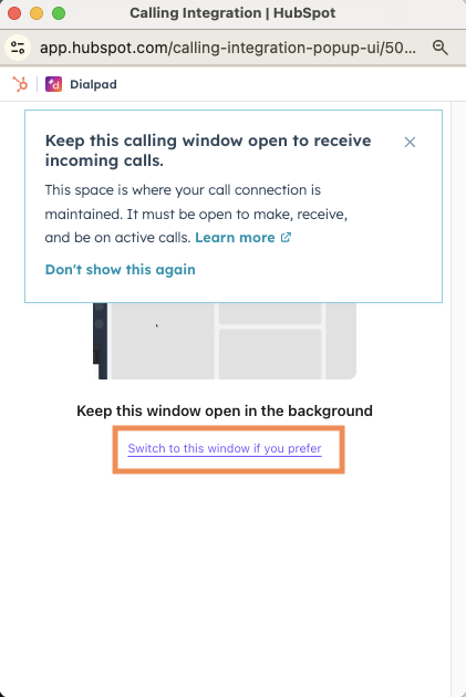Screenshot of the Dialpad calling integration pop-up window in HubSpot showing a prompt to keep the window open in the background, featuring an orange box highlighting the link 'Switch to this window if you prefer'.