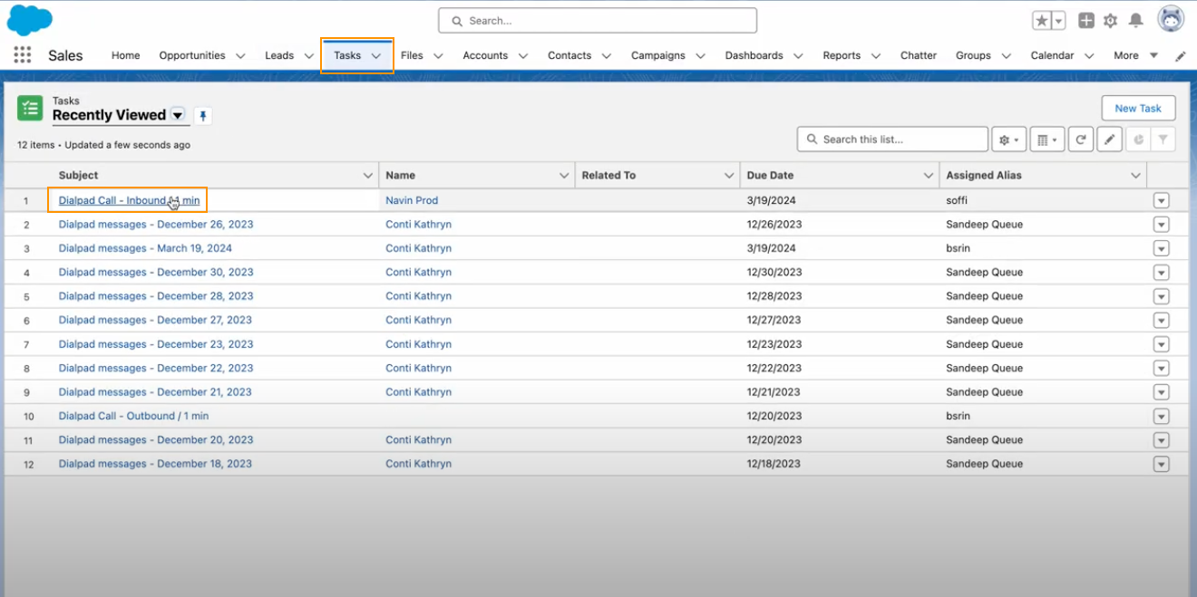 Screenshot of the Salesforce Lightning Tasks view, featuring orange boxes highlighting the 'Tasks' tab in the top navigation bar and a 'Dialpad Call - Inbound' entry selected in the task list.