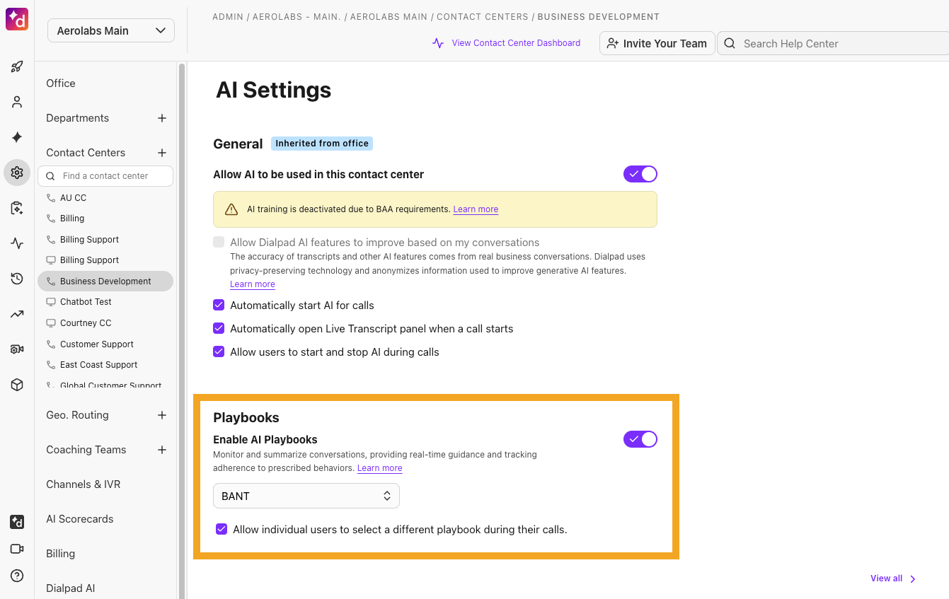 Dialpad Admin Settings showing the AI Settings menu with a toggle switch to enable AI Playbooks, a drop-down to set a default playbook for a Contact Center or Coaching Team, and a checkbox to allow individual users to select a different playbook during calls.