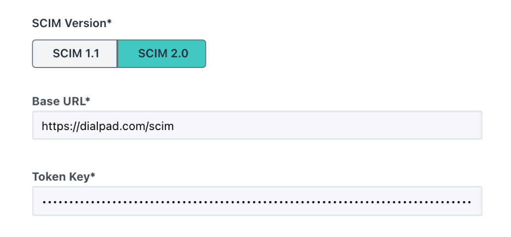 Screenshot of JumpCloud Identity Management configuration fields showing SCIM 2.0 selected, the Base URL field populated, and a hidden API key entered into the Token Key field.