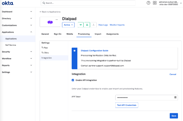 Screenshot of the Okta Provisioning Integration settings tab showing the 'Enable API Integration' checkbox checked, an API Token field populated with dots, and the 'Test API Credentials' and 'Save' buttons.