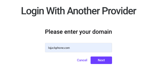Screenshot of the Dialpad Login With Another Provider screen showing lojackphone.com entered in the domain input field above Cancel and Next buttons.