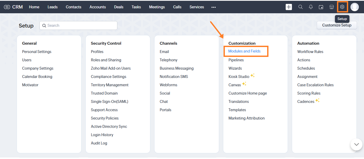 Screenshot of the Zoho CRM Setup dashboard showing the top navigation bar with the gear Setup icon highlighted, and an orange arrow pointing to "Modules and Fields" framed in an orange box under Customization.