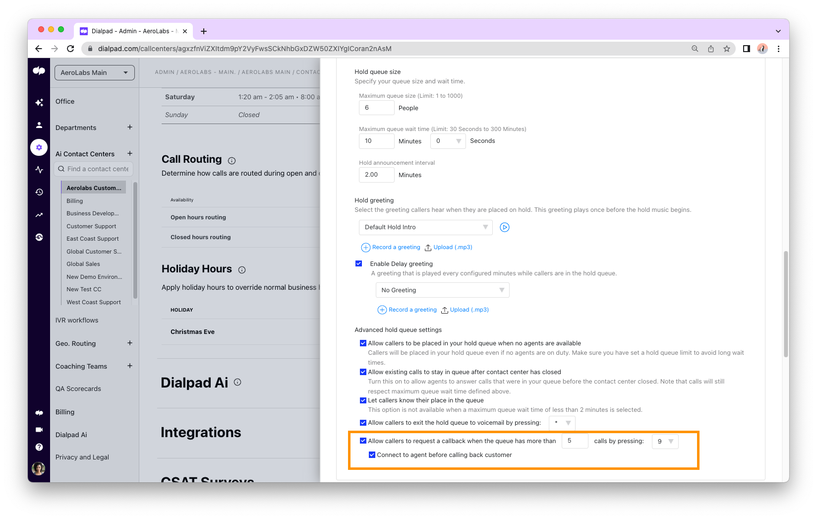 Dialpad Call Routing settings page highlighting the "Advanced hold queue settings" section in an orange box, showing checked options for allowing queue callbacks and the new sub-option "Connect to agent before calling back customer".